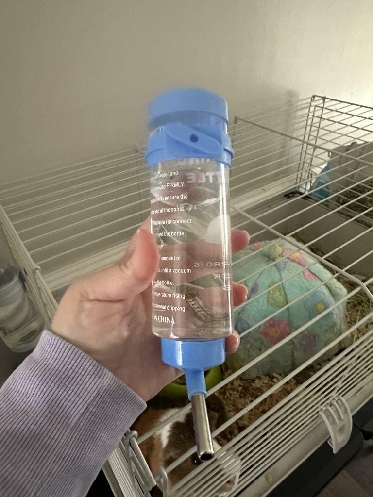 Depets 2PCS 8.45 oz No Drip Small Animal Water Bottle, Cage Water Bottles | Plastic, for Small Pet/Guinea Pig/Hamster/Bunny/Ferret/Rabbit, Hanging Wire & Buckle Included, Easy to Install, Yellow & Blue customer photo 2