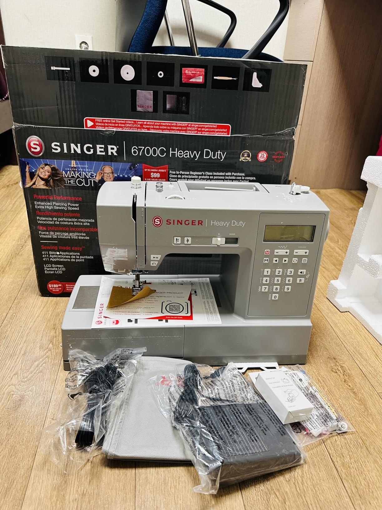 SINGER® 6700C Heavy Duty Computerized Machine with Accessory Kit | 411 stitch applications, lettering, touch button stitch selection, 1100 stitches/min,1-step buttonhole, LCD screen, LED light customer photo 1