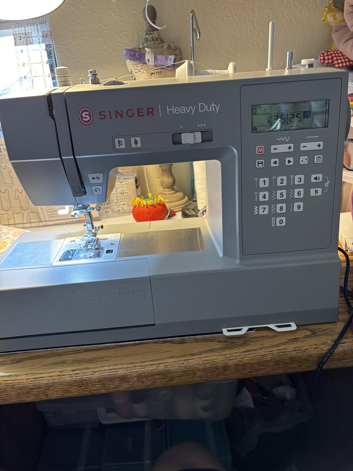 SINGER® 6700C Heavy Duty Computerized Machine with Accessory Kit | 411 stitch applications, lettering, touch button stitch selection, 1100 stitches/min,1-step buttonhole, LCD screen, LED light customer photo 2